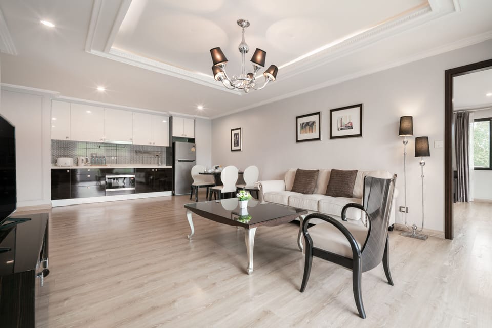Two Bedrooms Suite | Living area | 40-inch LED TV with cable channels, TV