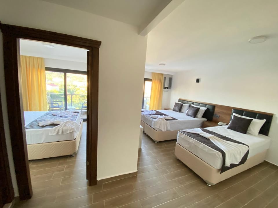 Family Room, 2 Bedrooms, Pool View | Laptop workspace, WiFi (free), individually decorated