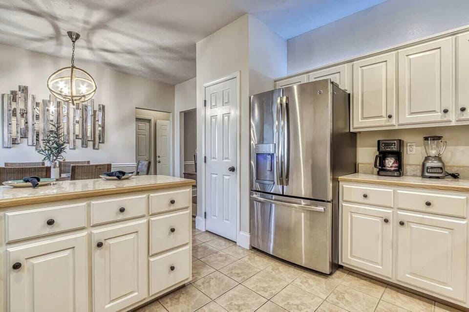 Modern appliances and stylish decor make meal prep a joy in this inviting space!