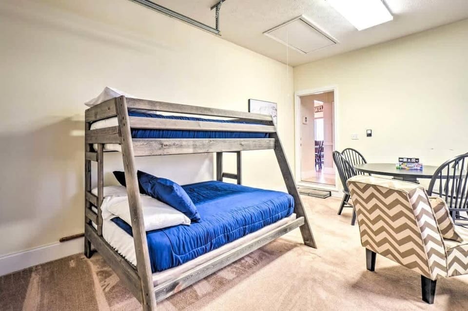 Bunk Room: Adventure awaits in this fun bunk room with vibrant blue bedding and stylish decor!