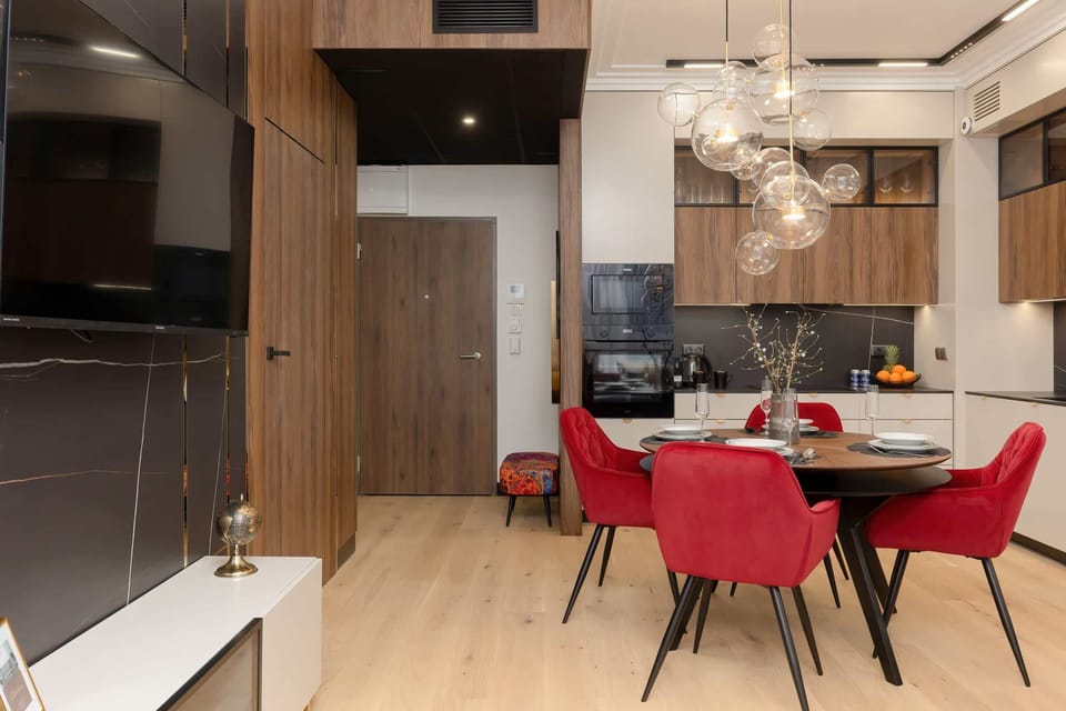 Another angle of the dining and kitchen area showcasing the open-plan layout and stylish furniture.
