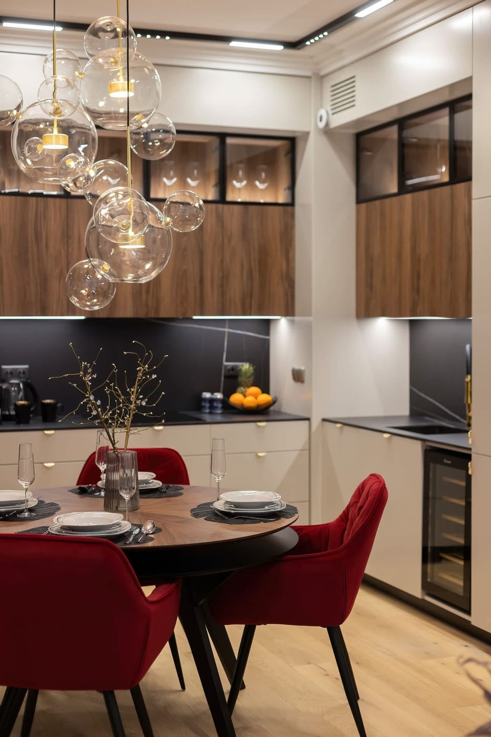 Another view of the dining area highlighting the elegant chandelier and contemporary design.

