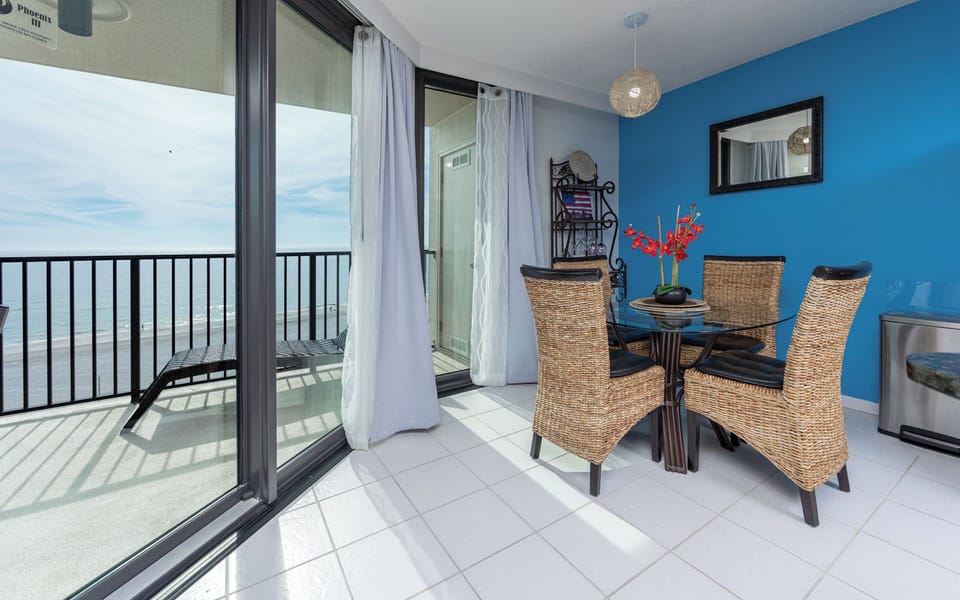 Cool coastal breeze drifts through your dining room as you plan a relaxing day on the shore