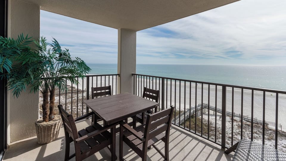 Warm sunlight brightens your balcony where you savor peaceful gulf views and gentle coastal breezes