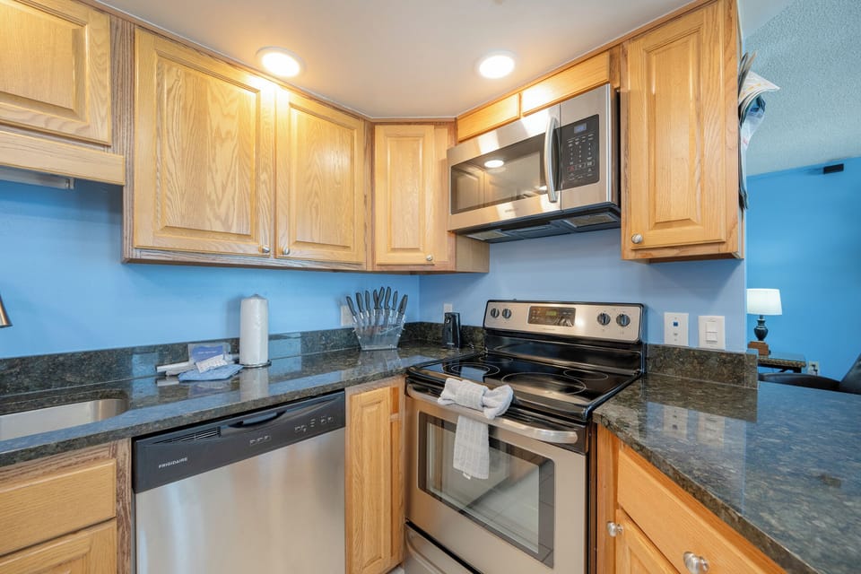 Stainless appliances and granite countertops in this updated kitchen