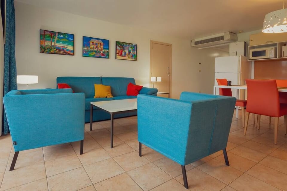 Step onto your private patio and soak in breathtaking views of the ocean, airport, and lush gardens. Whether you're plane-spotting or simply relaxing, the scenery is unforgettable.