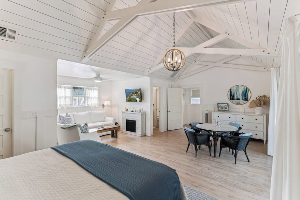 Relax in your spacious retreat where exposed beams and coastal blues create the perfect blend of rustic charm and seaside serenity.