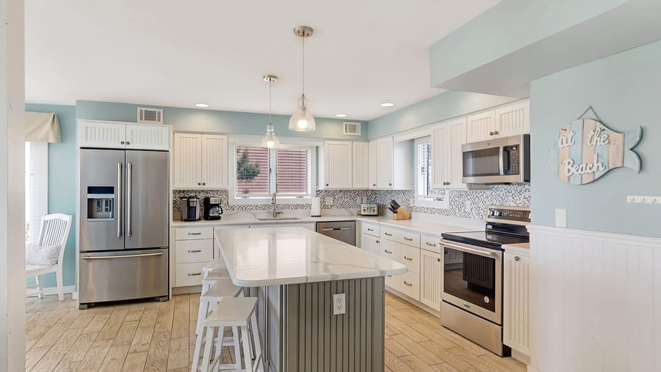 Side view of the kitchen with seating on the island.