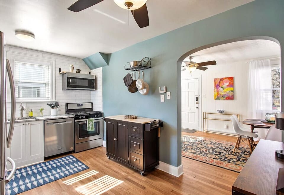Fully stocked and ready for your culinary adventures! Features a microwave, dishwasher, and easy access to the backyard.