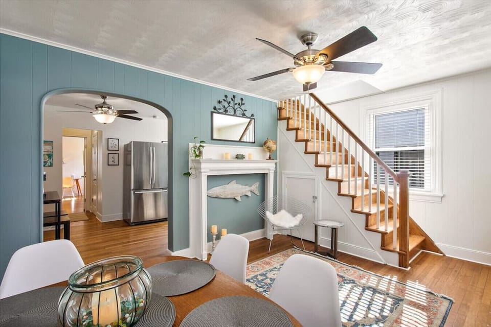 A warm and inviting space with a drop-leaf table for extra seating—perfect for intimate meals or game nights!