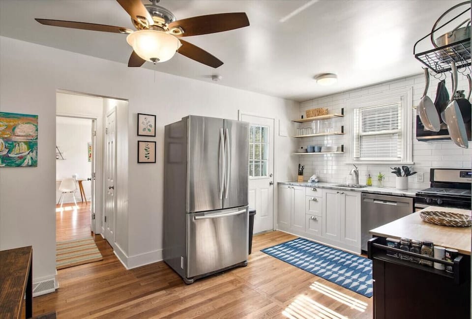 Fully stocked and ready for your culinary adventures! Features a microwave, dishwasher, and easy access to the backyard.