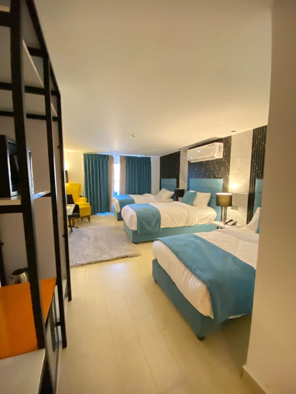 Triple Room | Minibar (some free items), in-room safe, laptop workspace