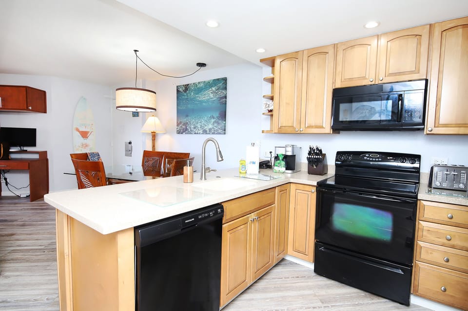 Open airy kitchen with full size appliances.