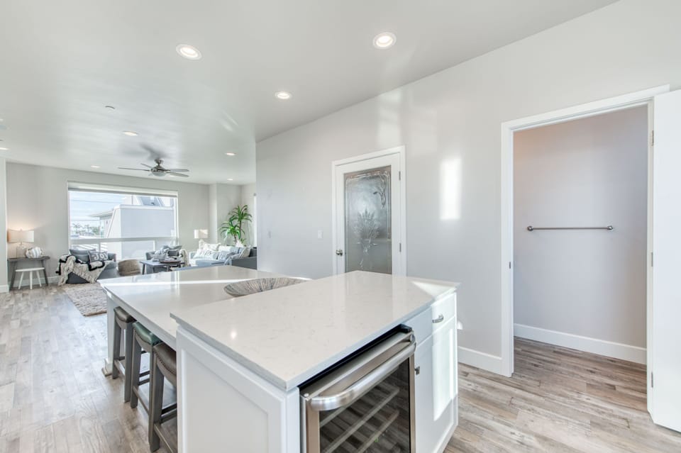 Kitchen extends into living room.