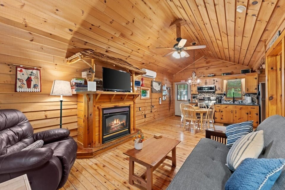 Living room with futon and gas fireplace