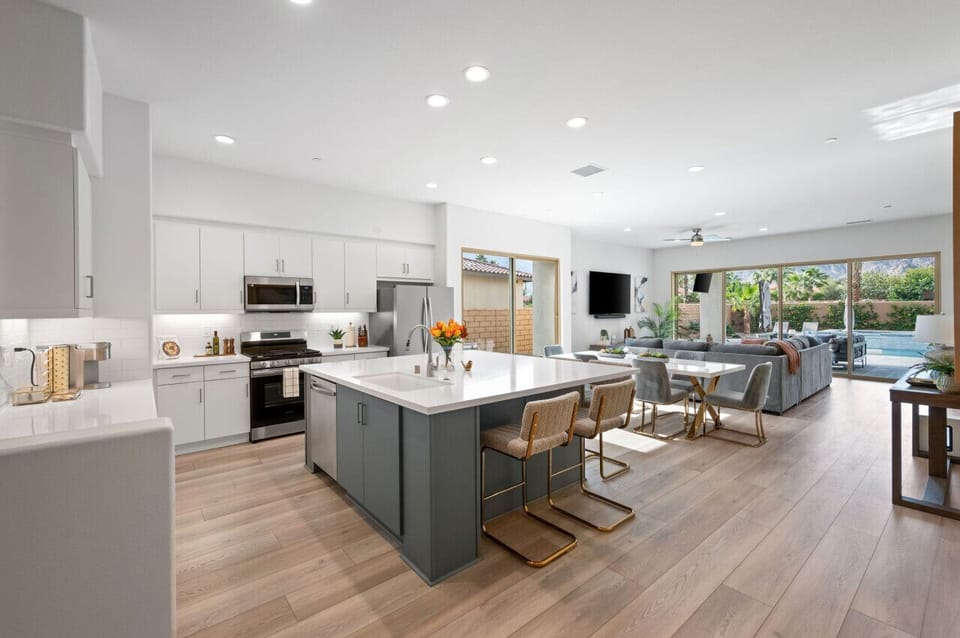 Open-concept kitchen w/ large island, bar seating & plenty of space to gather