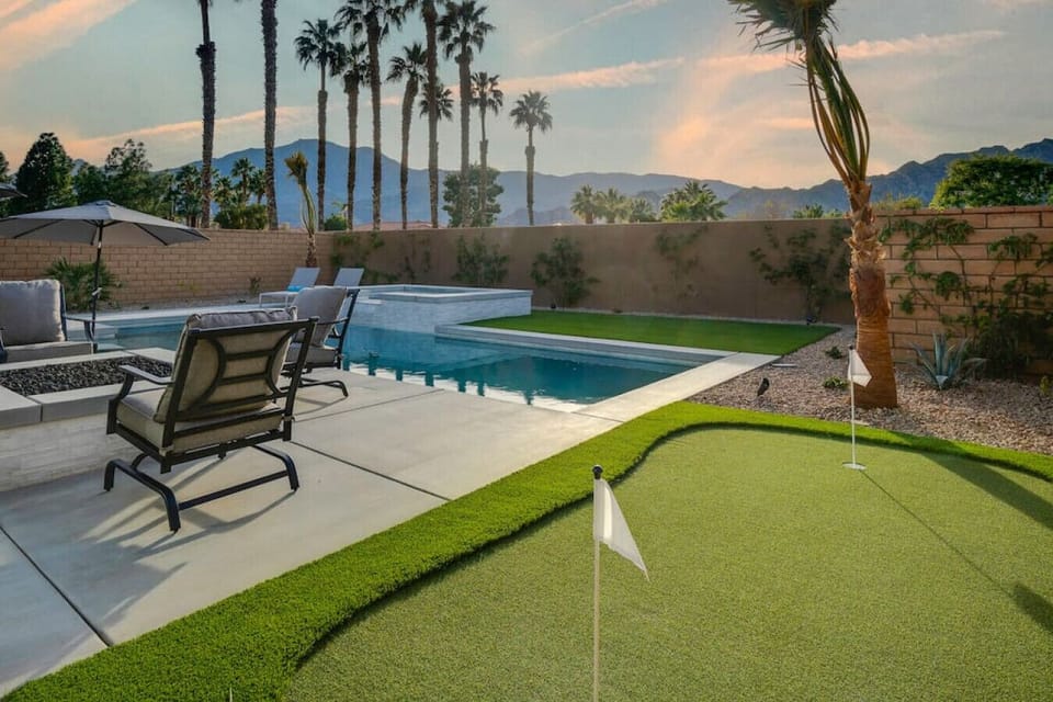 Private yard w/ turf area, pool & seating for laid-back outdoor fun