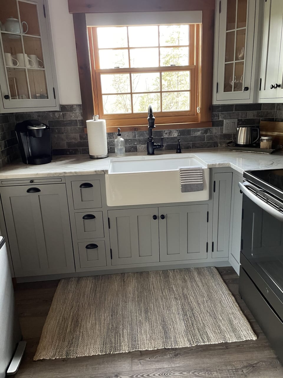 Kitchen is equipped with appliances such as Keurig coffee maker & electric pot