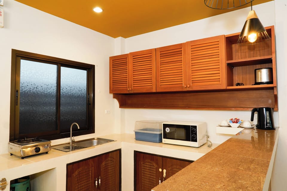 Villa | Private kitchen | Fridge, coffee/tea maker