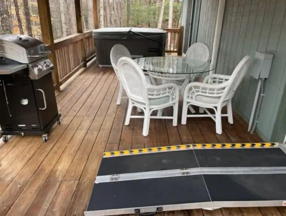 Back deck: gas grill, eating table & chairs under roof, hot tub and easy ramp.