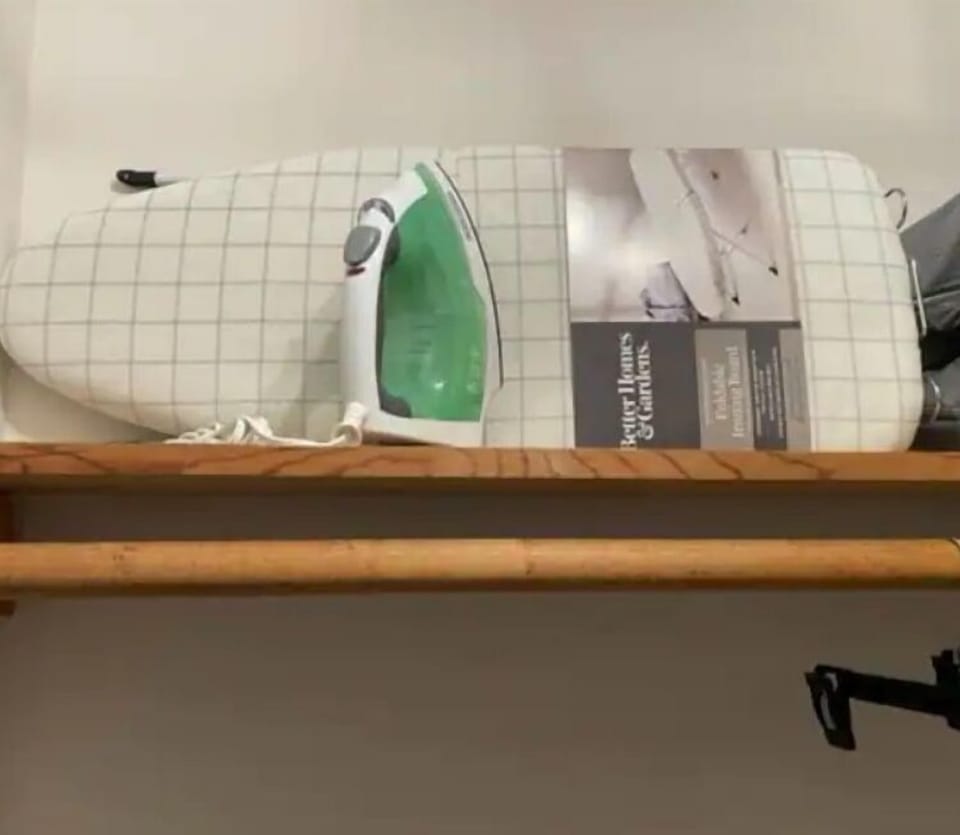 Iron and ironing board are in master bedroom closet