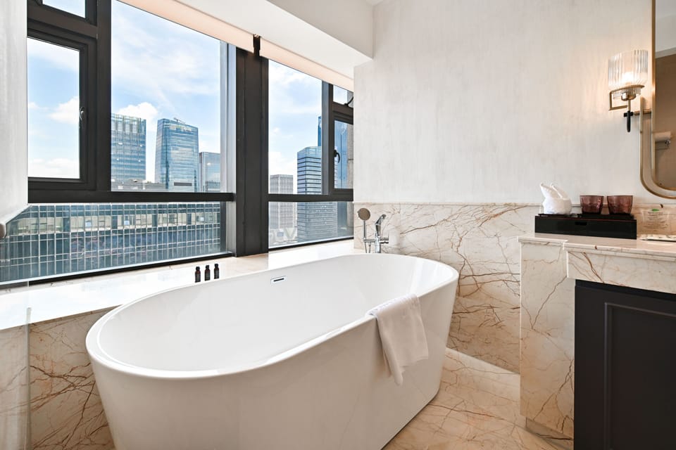 Separate tub and shower, hair dryer, bathrobes, slippers