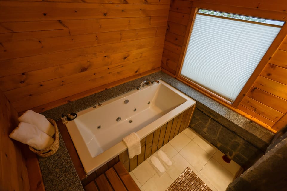 Bungalow, 1 Bedroom | Bathroom | Shower, hydromassage showerhead, free toiletries, hair dryer