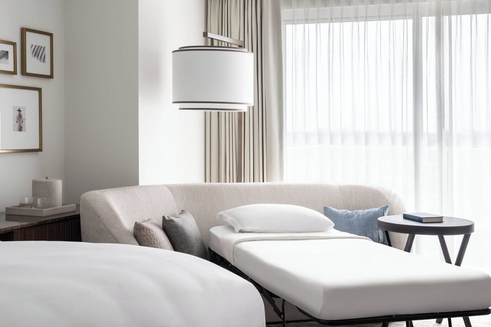 Premium bedding, down comforters, minibar, in-room safe