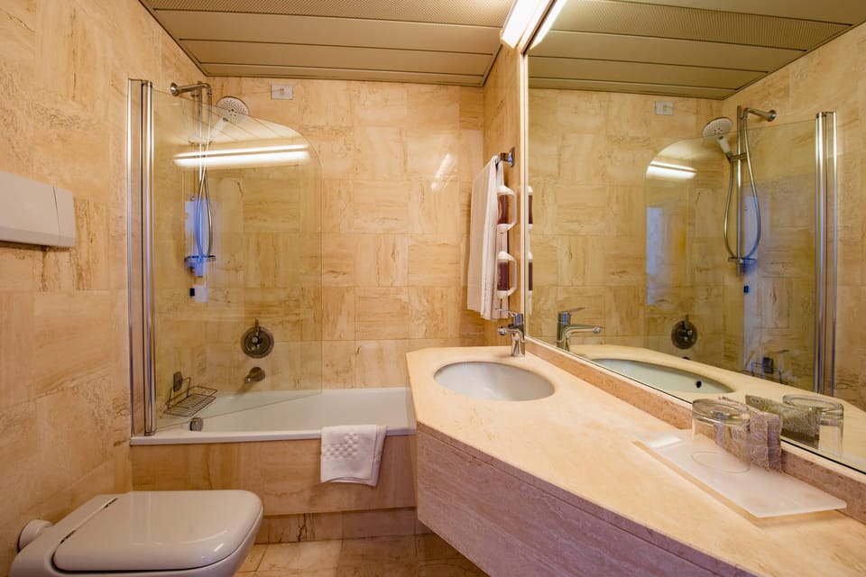 Standard Double Room, 1 Queen Bed with Sofa bed | Bathroom | Combined shower/tub, hair dryer, bidet, towels