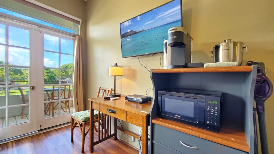 HD Smart TV. Desk, Microwave & Coffee maker