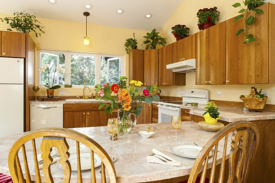 The marble kitchen peninsula is another fine dining option for two. 