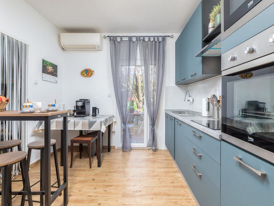 Villa (Four Bedroom Villa with Swimming Pool) | Private kitchen | Fridge, dining tables