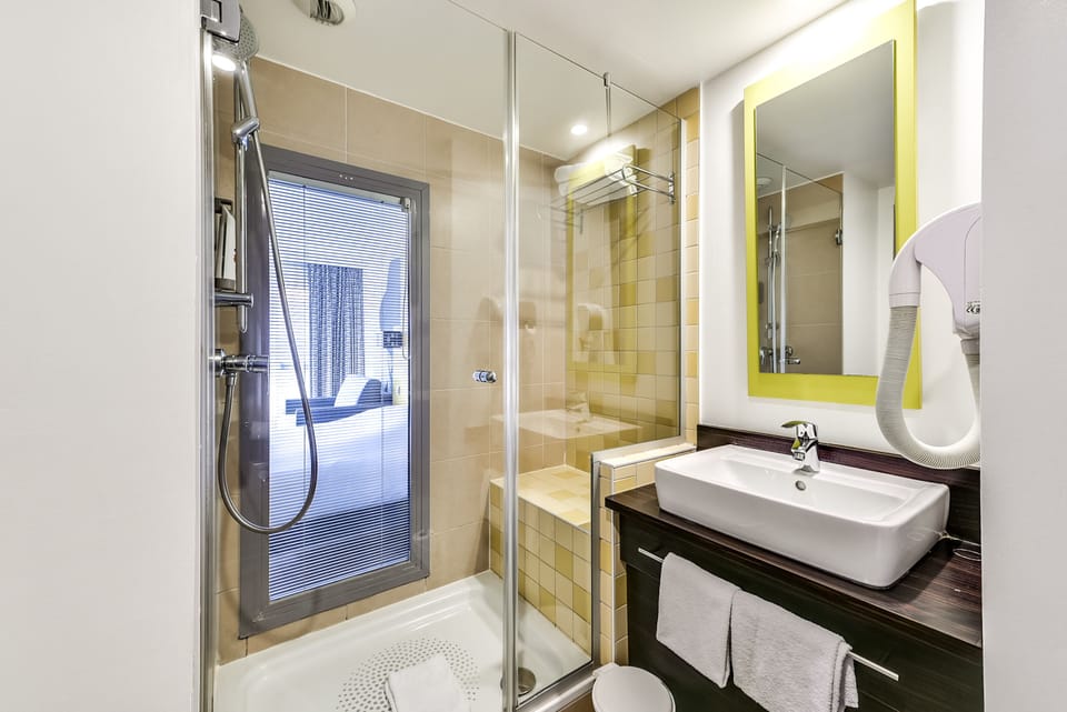 Shower, eco-friendly toiletries, hair dryer, towels