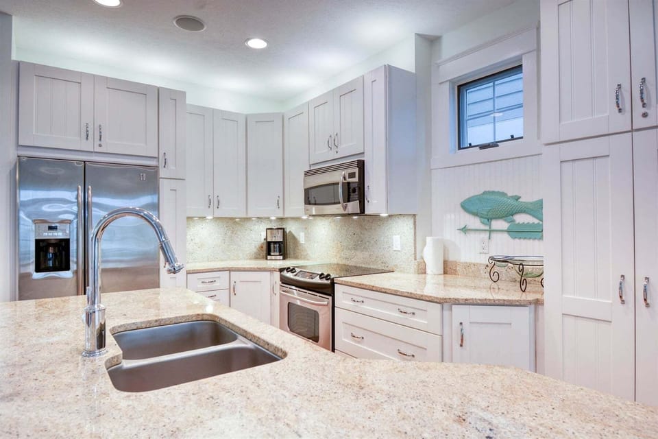 Fully equipped kitchen with granite counters and stainless appliances