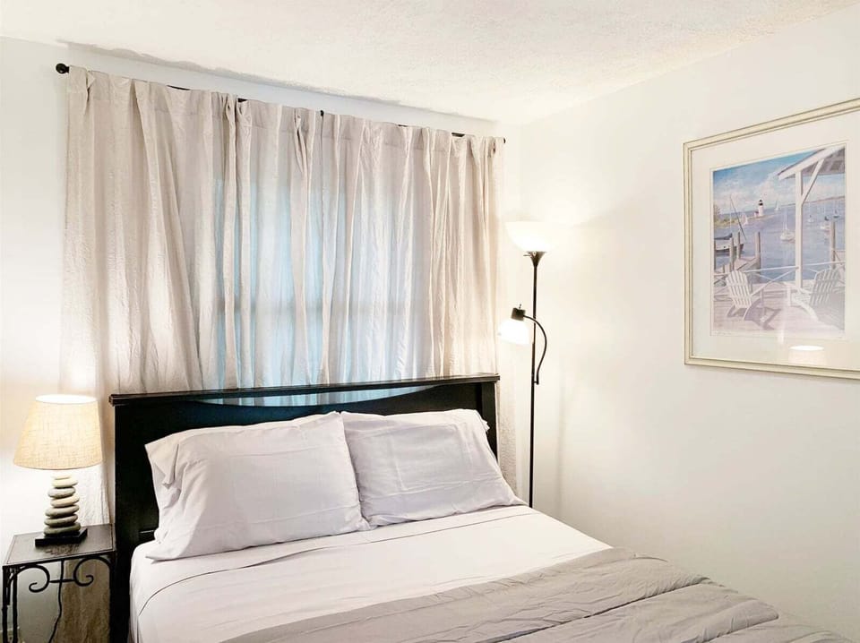 Queen bedroom is cozy and offers plenty of storage
