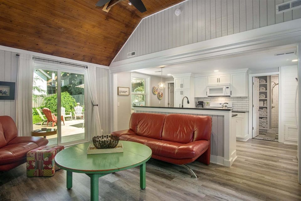 Open living and kitchen has sliders that lead to the patio