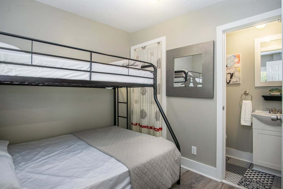 Pyramid bedroom has an attached half bath and stacked washer and dryer