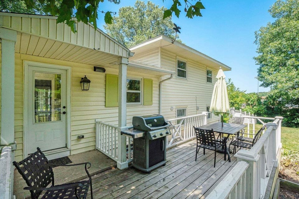 Back deck with outdoor furniture and fenced in yard