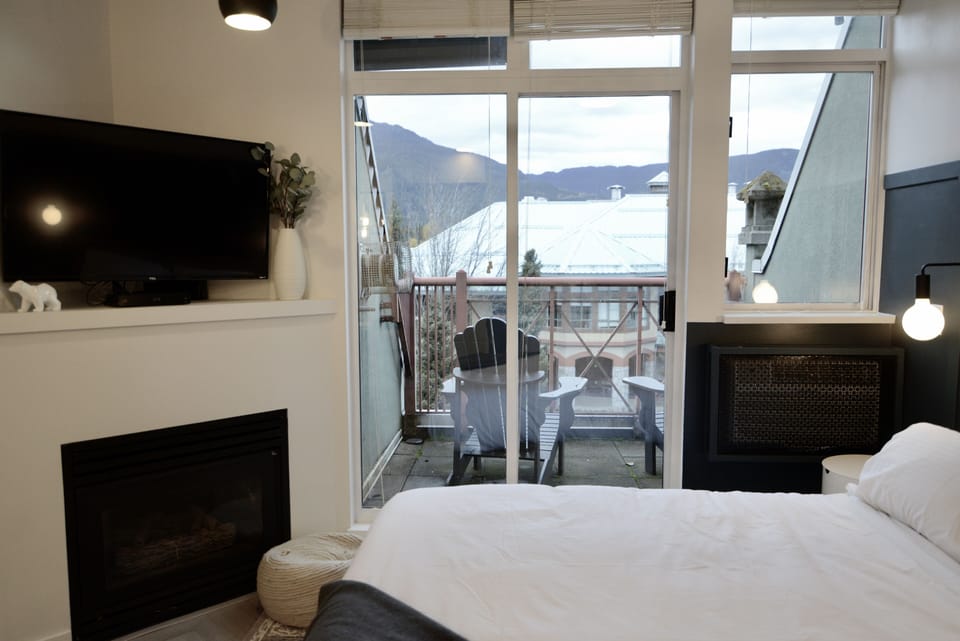Mountain views from the bedroom with patio seating!