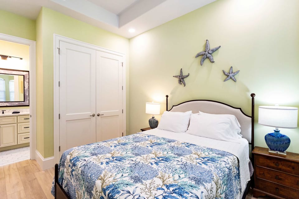 Bedroom Suite #1 with queen bed, large closet and adjoining bathroom.