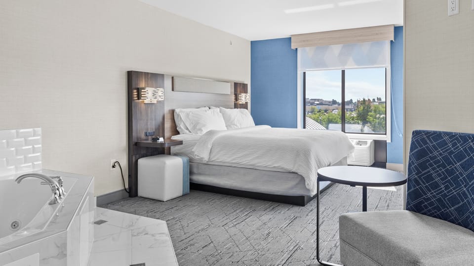 Suite, 1 King Bed, Jetted Tub | In-room safe, desk, blackout drapes, iron/ironing board