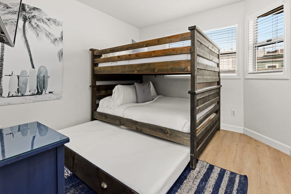 This room also includes a pull-out single bed, offering additional sleeping space for guests.