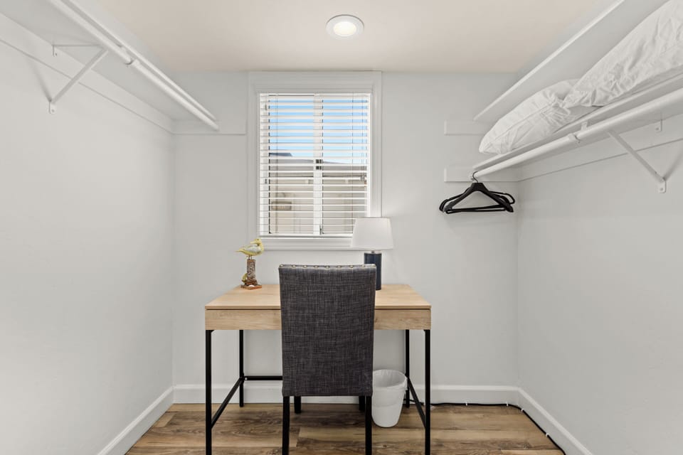 The property features a quiet area with a desk and lighting.