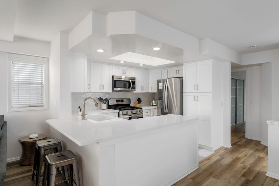 The Kitchen flows seamlessly into the living space, offering ample space for dining and connecting with family or friends.
