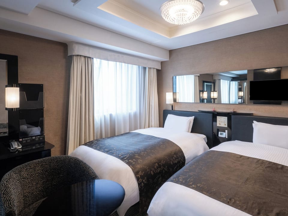 Deluxe Twin Room, Non Smoking | Desk, laptop workspace, blackout drapes, free WiFi