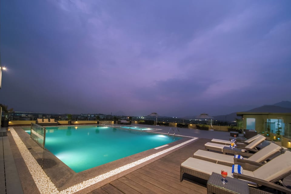 Outdoor pool, open 7:00 AM to 7:00 PM, sun loungers