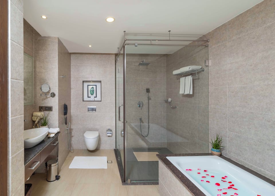 Separate tub and shower, rainfall showerhead, free toiletries