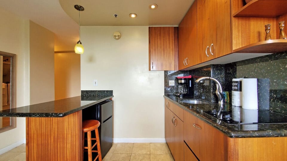 Nicely stocked kitchenette with mini fridge.