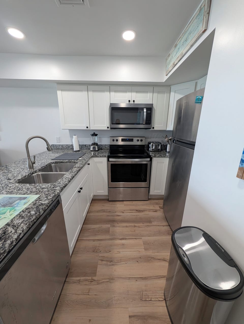 Step into your bright, fully equipped kitchen with stainless steel appliances, and everything you need to whip up delicious meals during your stay.