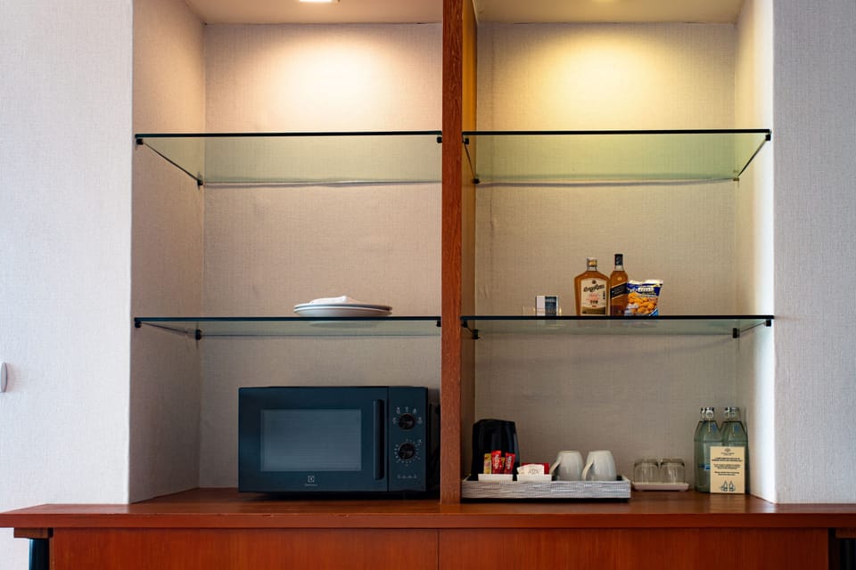 Paradise Suite Room | Minibar, in-room safe, desk, laptop workspace